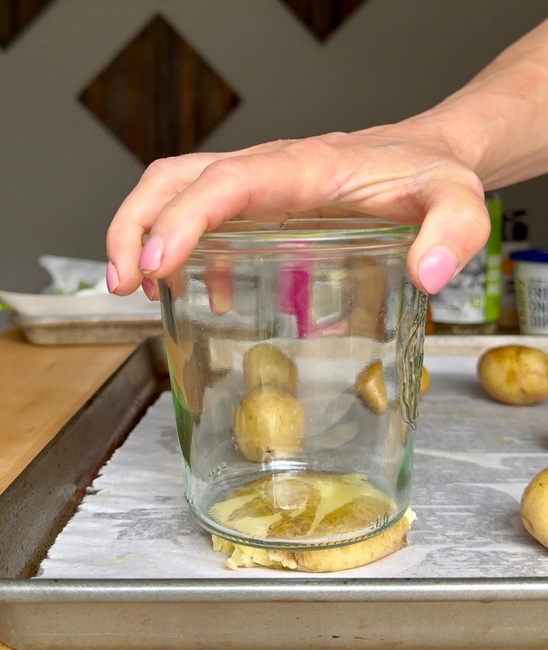 using a mason jar to smash potatoes