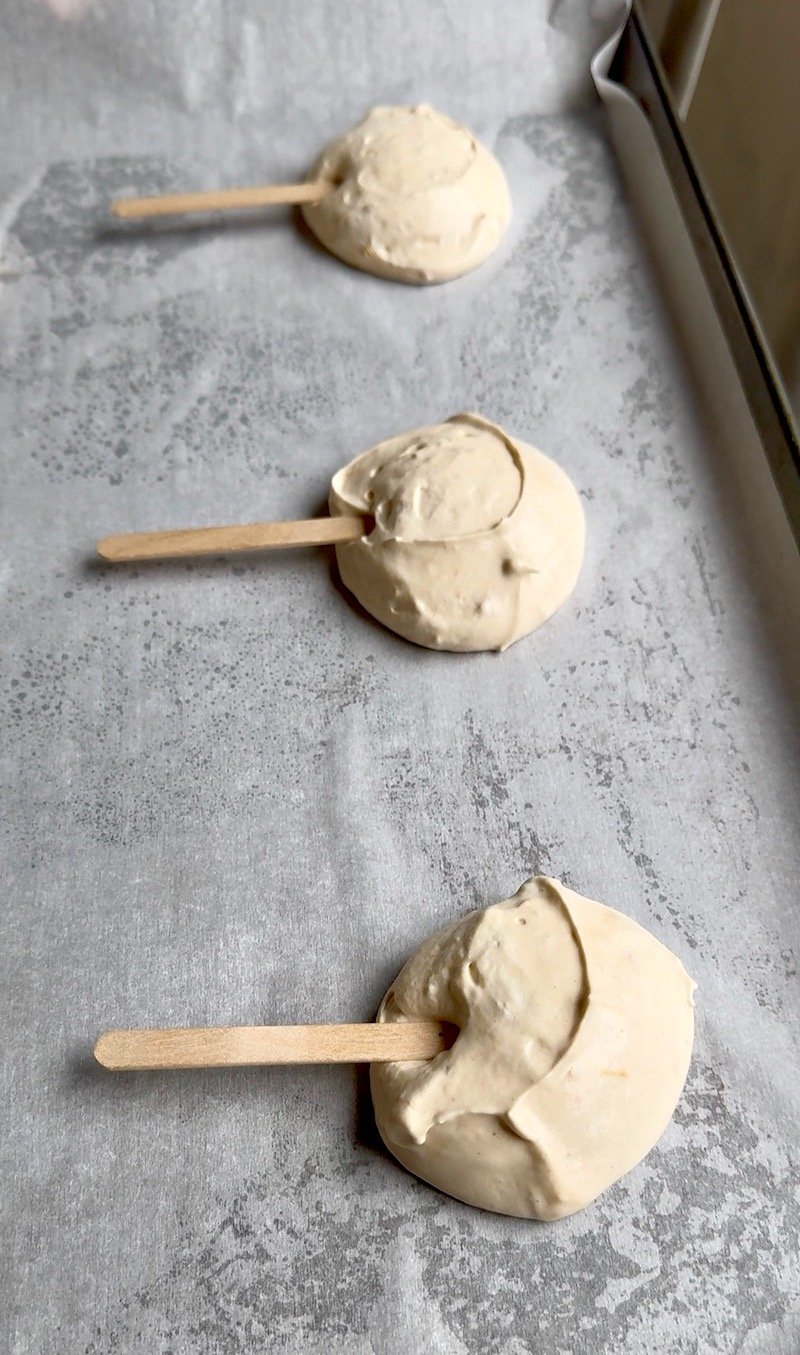 adding popsicle sticks to homemade yasso bars