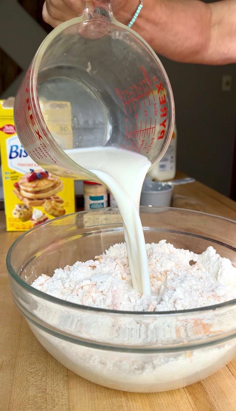 adding milk to biscuits