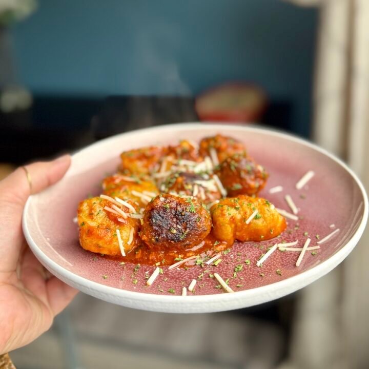 this is a plate of delicata squash gnocchi with meatballs