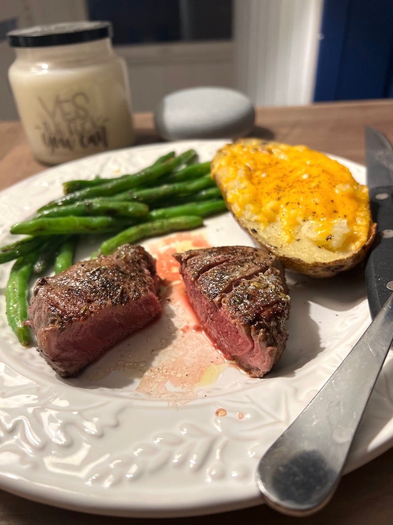 this is hungyroot plate of filet mignon, green beans and twice baked potatoes
