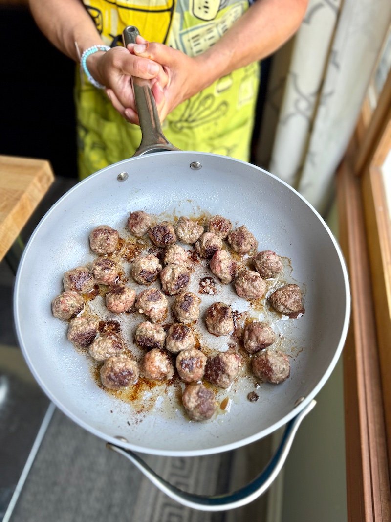 mini meatballs in a pan for pasta fagioli