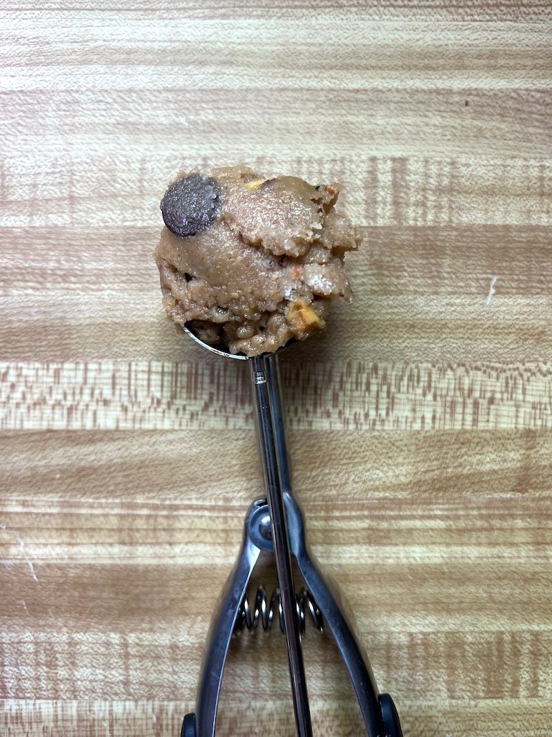 using a cookie scoop ensures even baking time for chocolate chip pistachio cookies