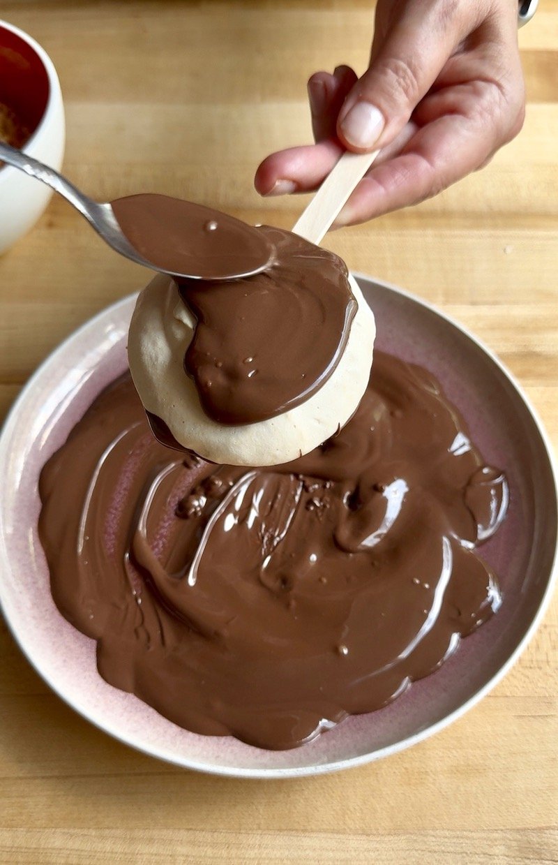 spreading chocolate on homemade yasso bars