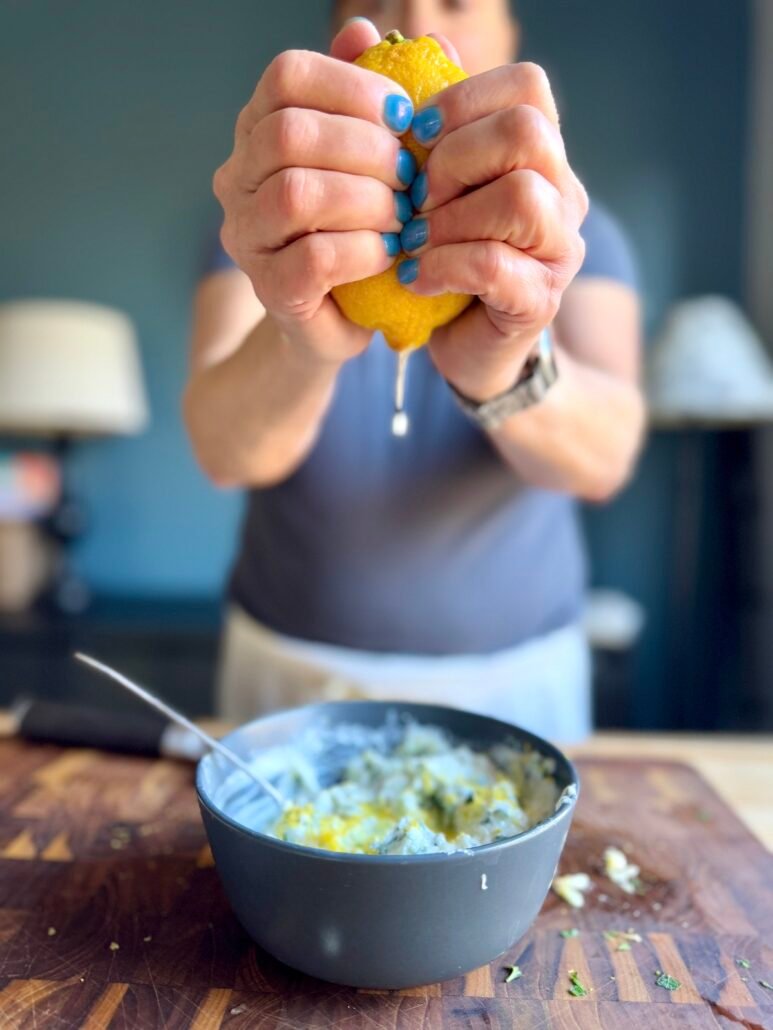 this is lemon juice being squeezed from a fresh lemon