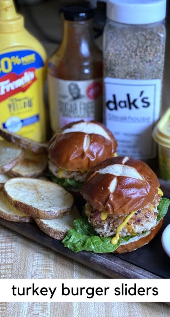 The secret to a juicy turkey burger is butter in the middle! Simple spread with I Can’t Believe It’s Not Butter Light and pinky swear you won’t have another dry turkey burger. Mini Turkey Burger | Weight Watchers | Pretzel Bun #turkeyburger #turkey #sliders